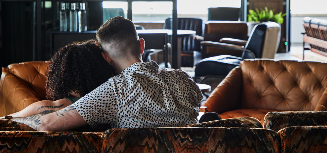 couple on couch seen from behind