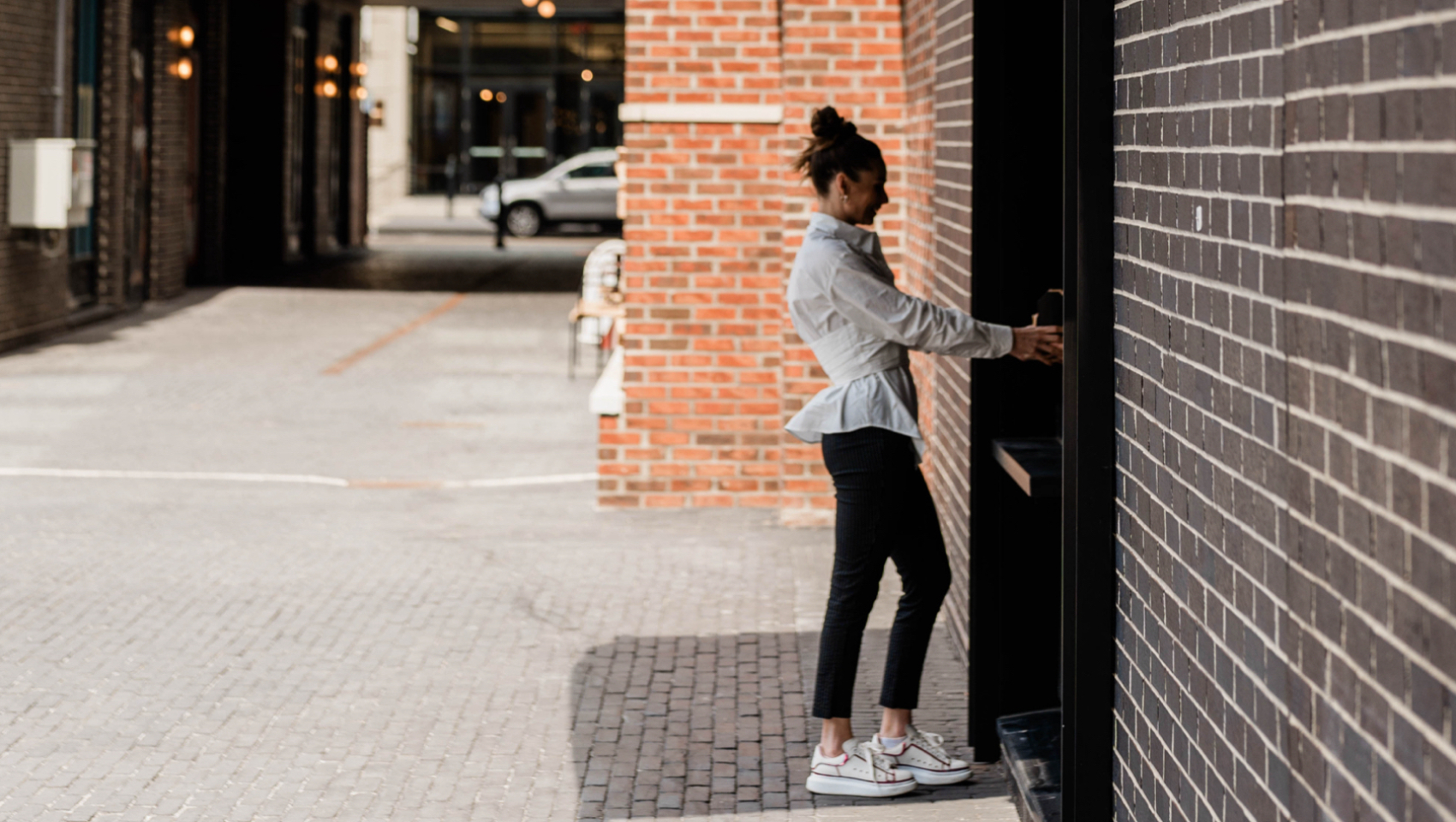 woman standing at food window
