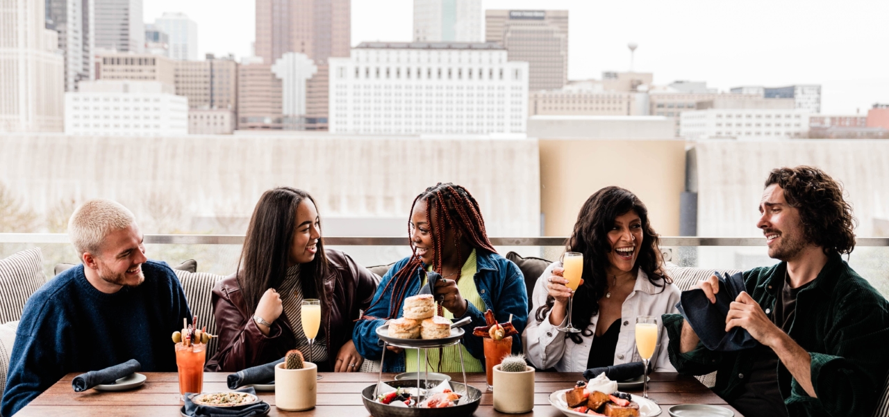 Group of friends having brunch on a rooftop
