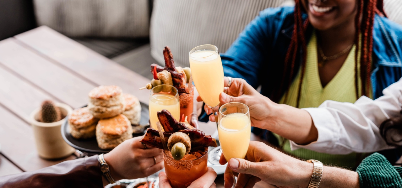 Friends doing a toast at brunch