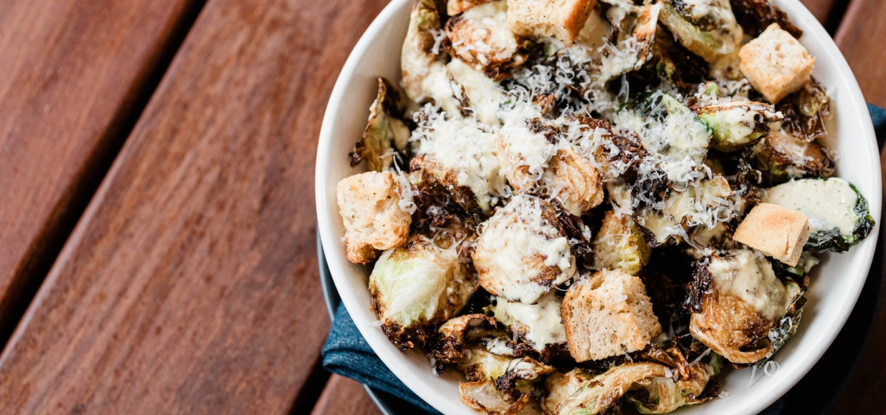 Roasted brussel sprouts and croutons in bowl