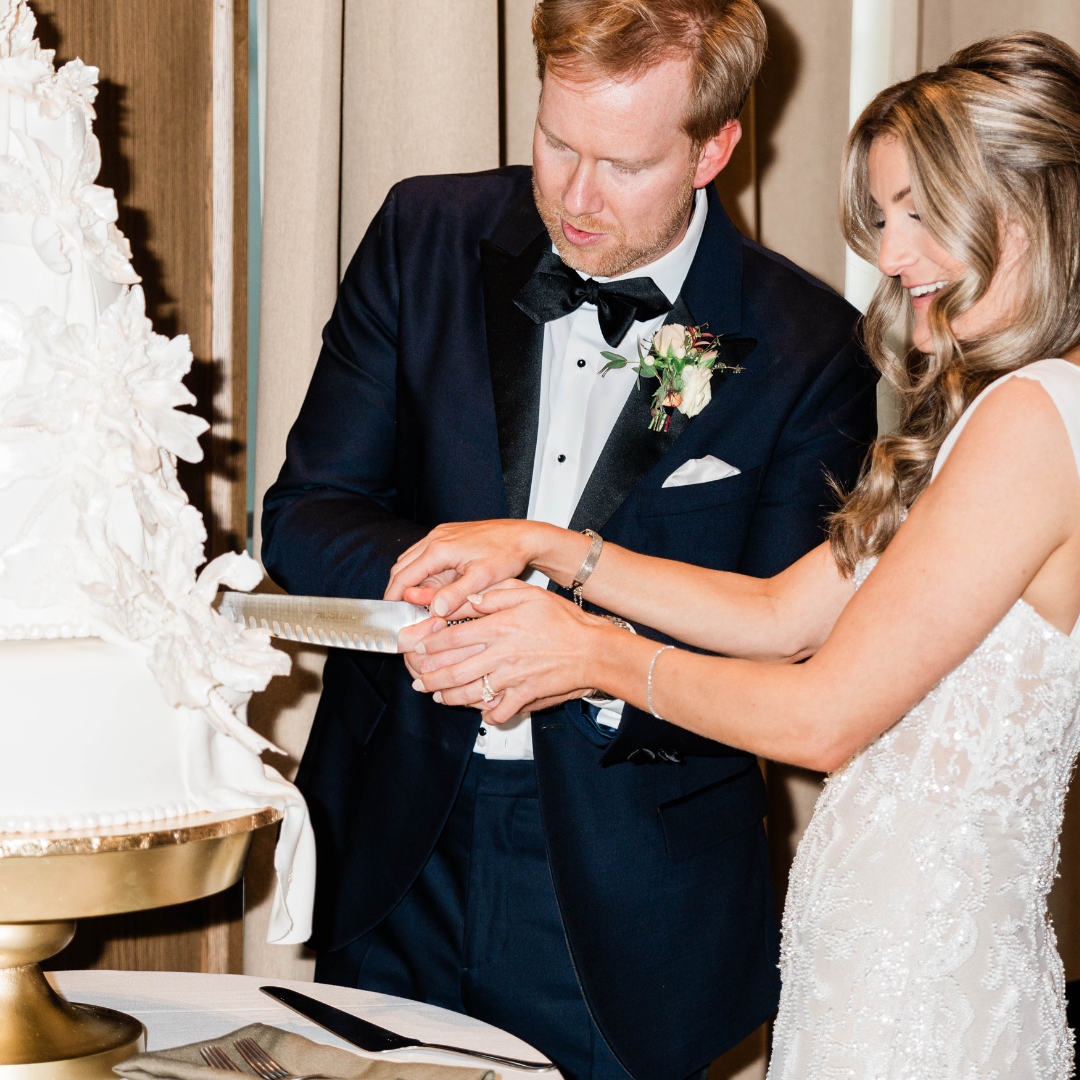 Bride and groom cutting a cake