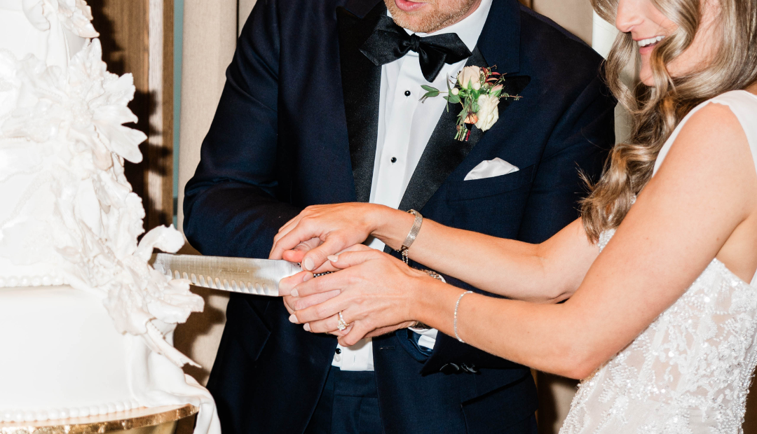 Bride and groom cutting a cake
