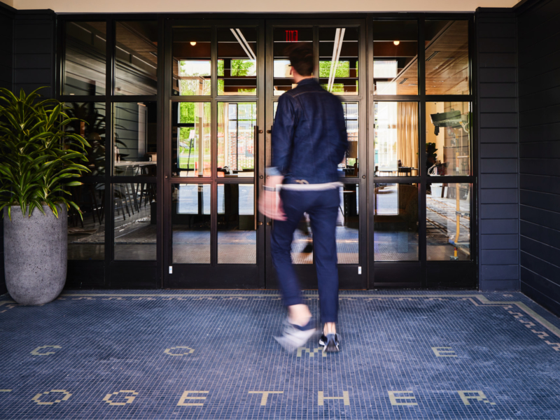 Man entering the Junto Hotel in Columbus, Ohio