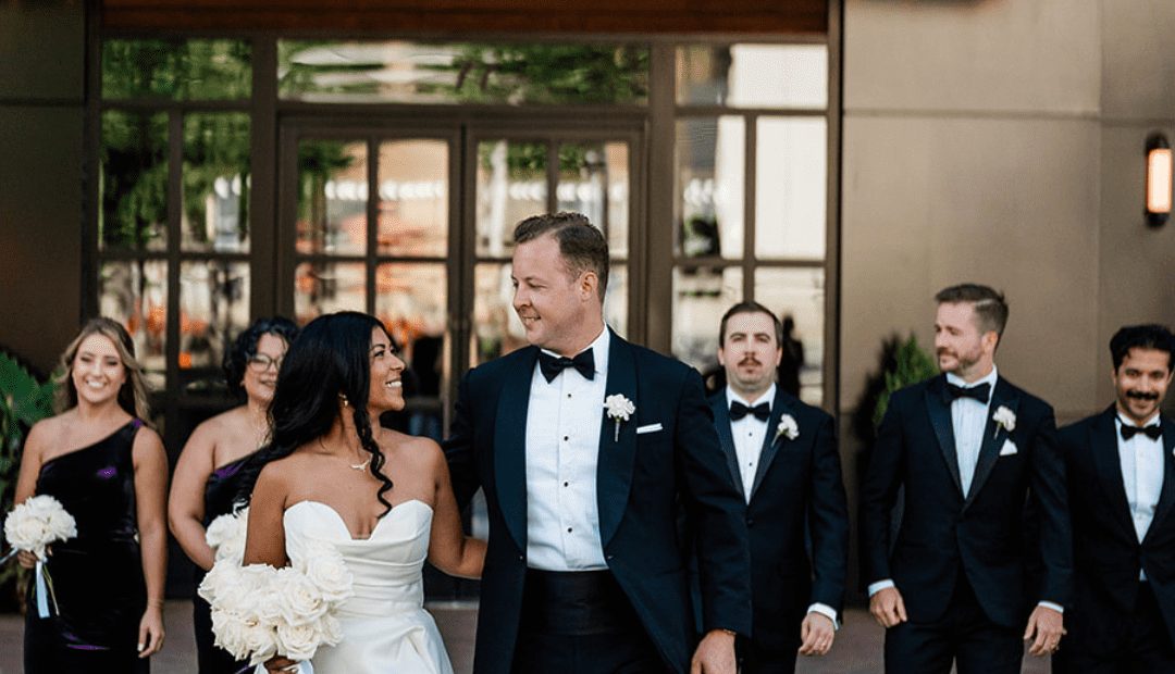 Wedding party in front of hotel entry