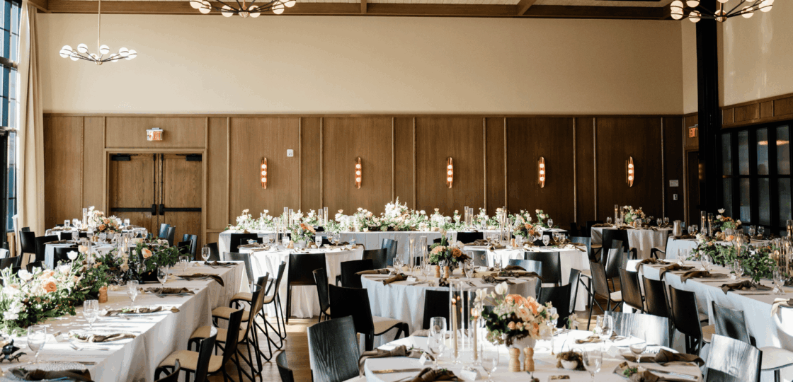Ballroom with white linen setup for wedding
