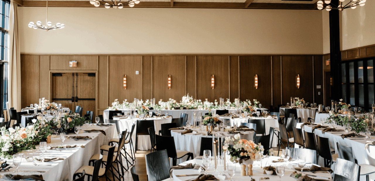 Ballroom with white linen setup for wedding