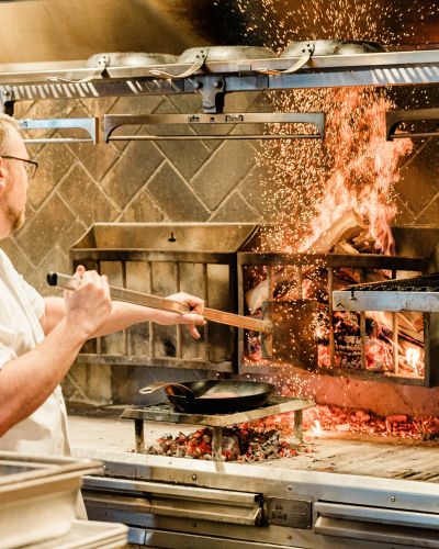 Little West Tavern chef stoking the hearth