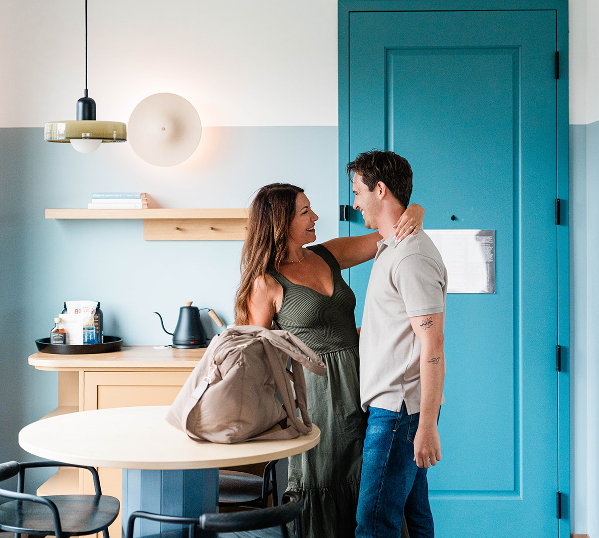 Couple hugging in guest room