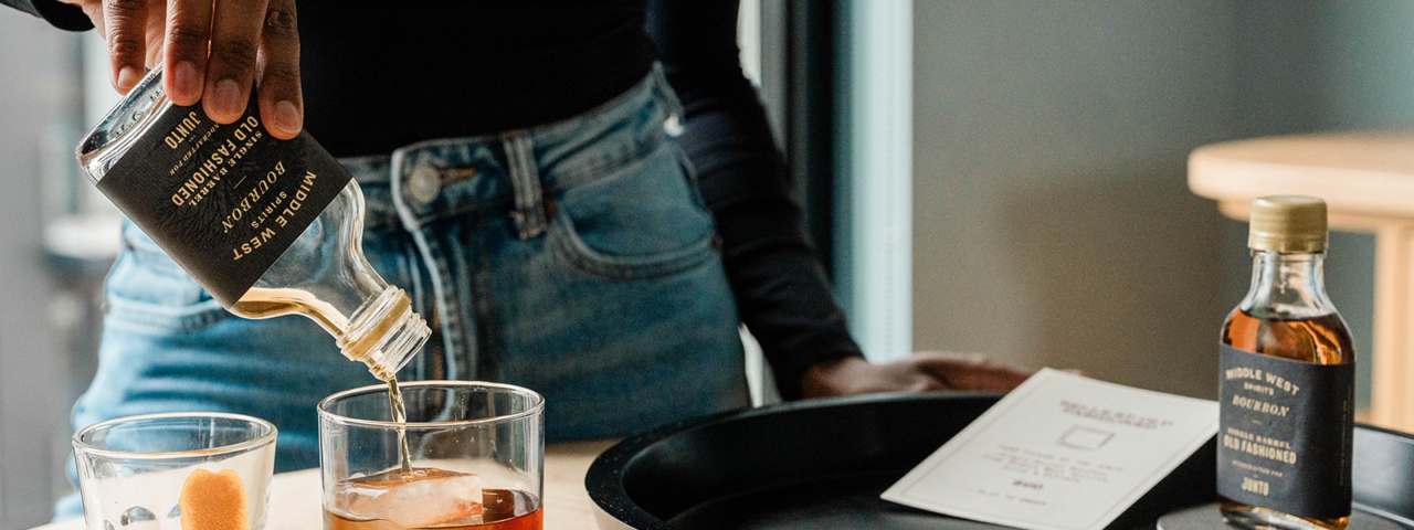 Woman pouring drink in guest room