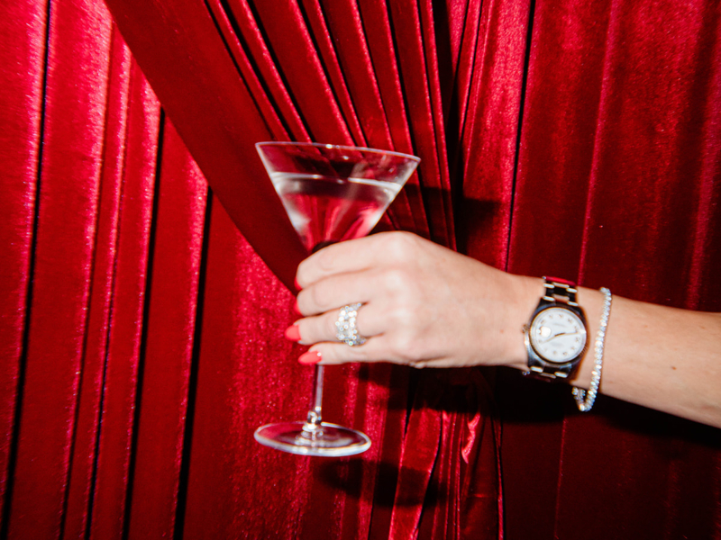 cocktail in front of red velvet